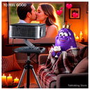 Horlat projector backyard outdoor cinema party with green yellow and orange amoeba characters under night sky
