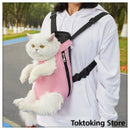 Pink grid cat carrier backpack on city street with Glimbo and Glimby mascots - urban adventure