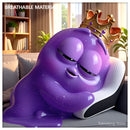 Toktoking Amoeba mascot relaxing on orthopedic butterfly neck pillow on cozy sofa - cervical support lifestyle
