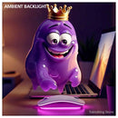 Amoeba mascot hovering above backlit wireless mouse with excitement