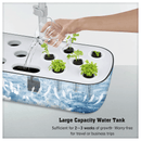 Adjustable height arm on hydroponics system – accommodating tall herb plants